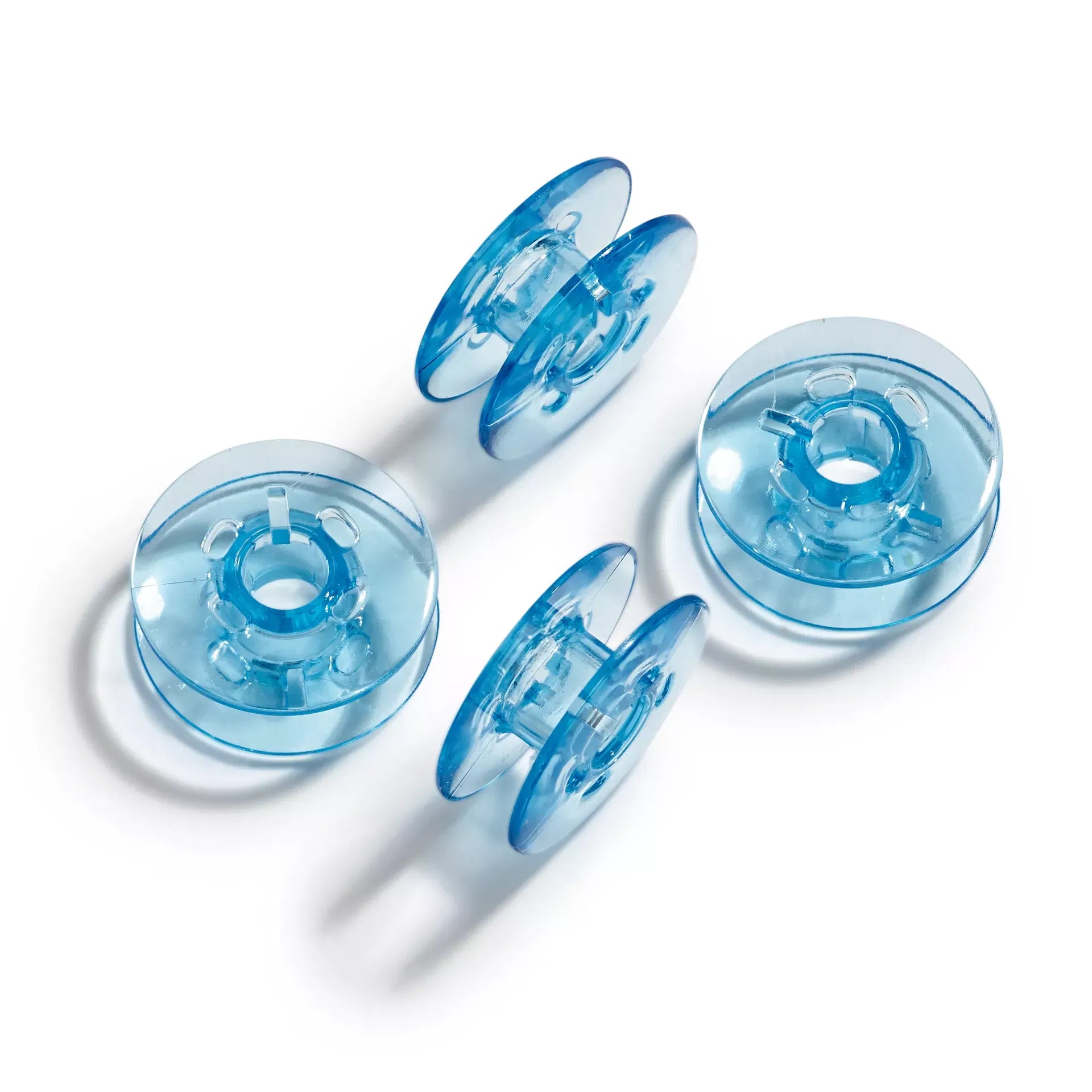 Sewing machine bobbins for double rotating bobbin case