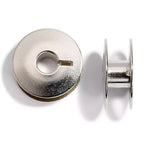 Metal sewing machine bobbins for rotary bobbin holders